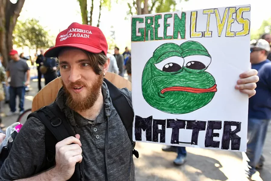 Illing, S. (2019) [Andrew Knight holds a sign of Pepe the frog, an alt-right icon, during a rally in Berkeley, California on April 27, 2017.]
