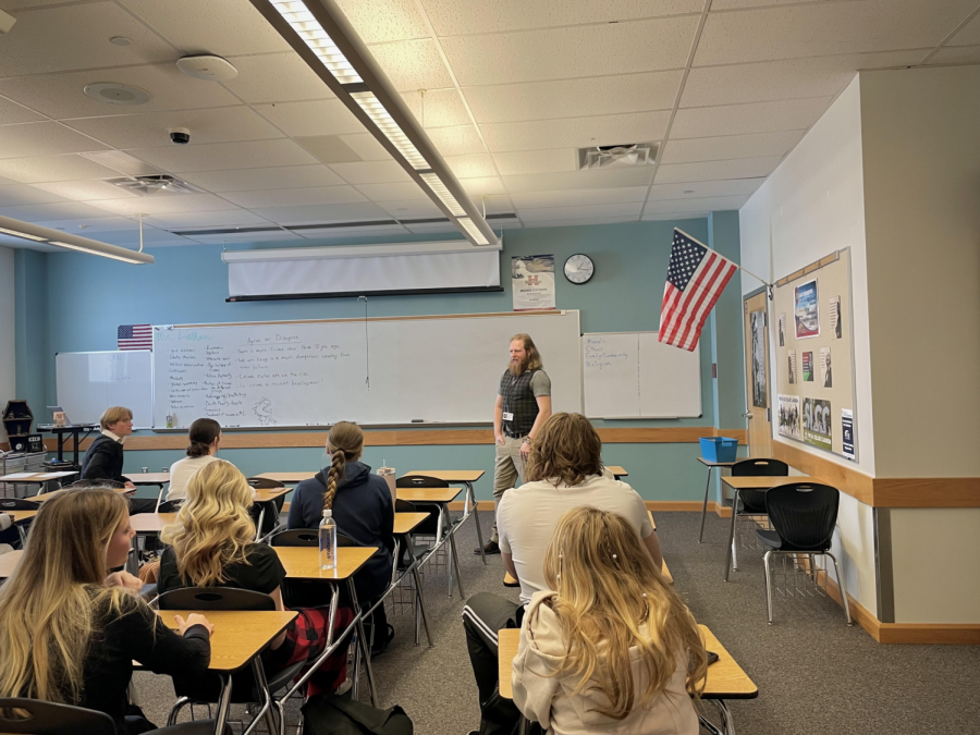 Photo by Natasha Shelton of Tanner Latham teaching Debate          